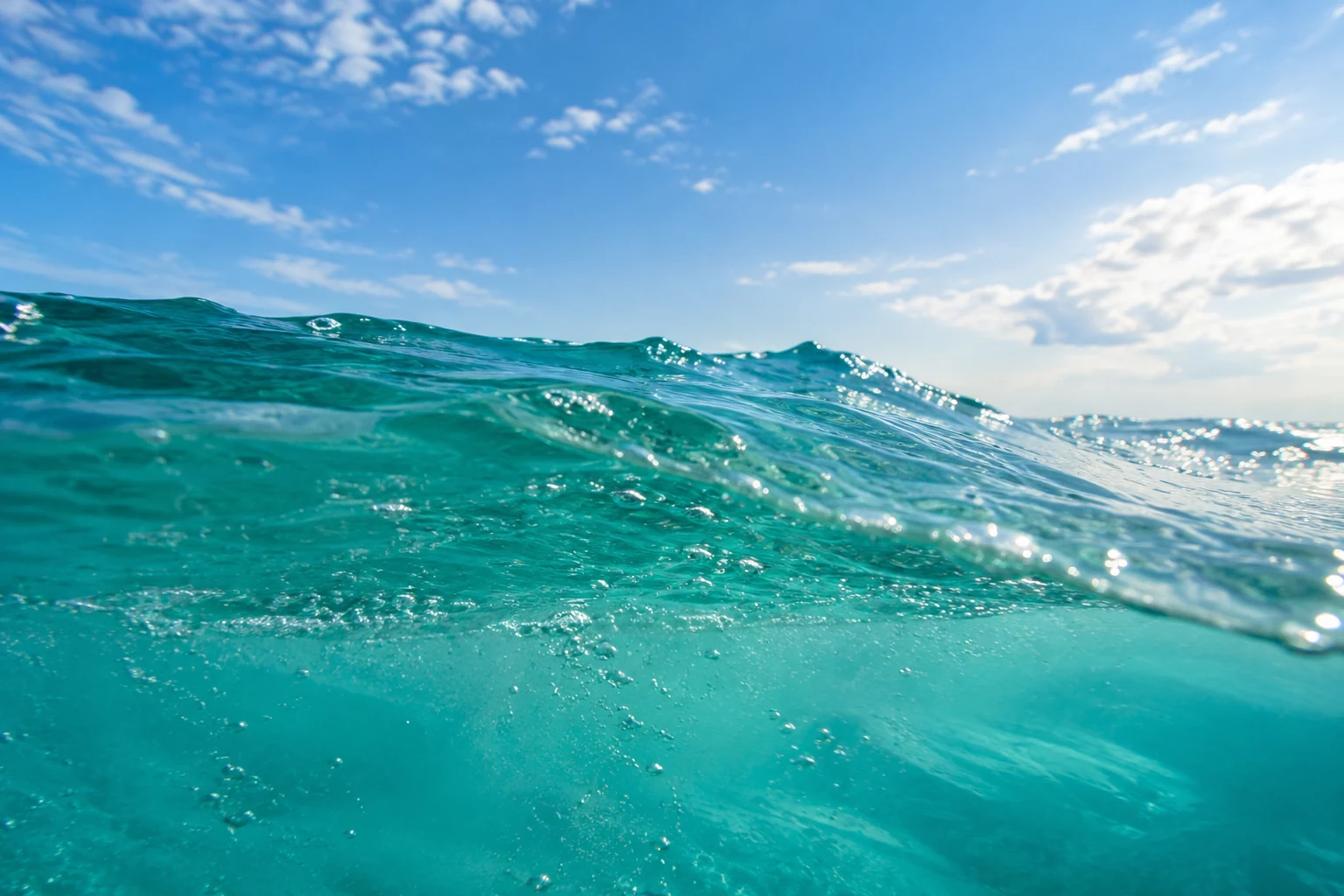 Clear teal ocean water with natural bubbles