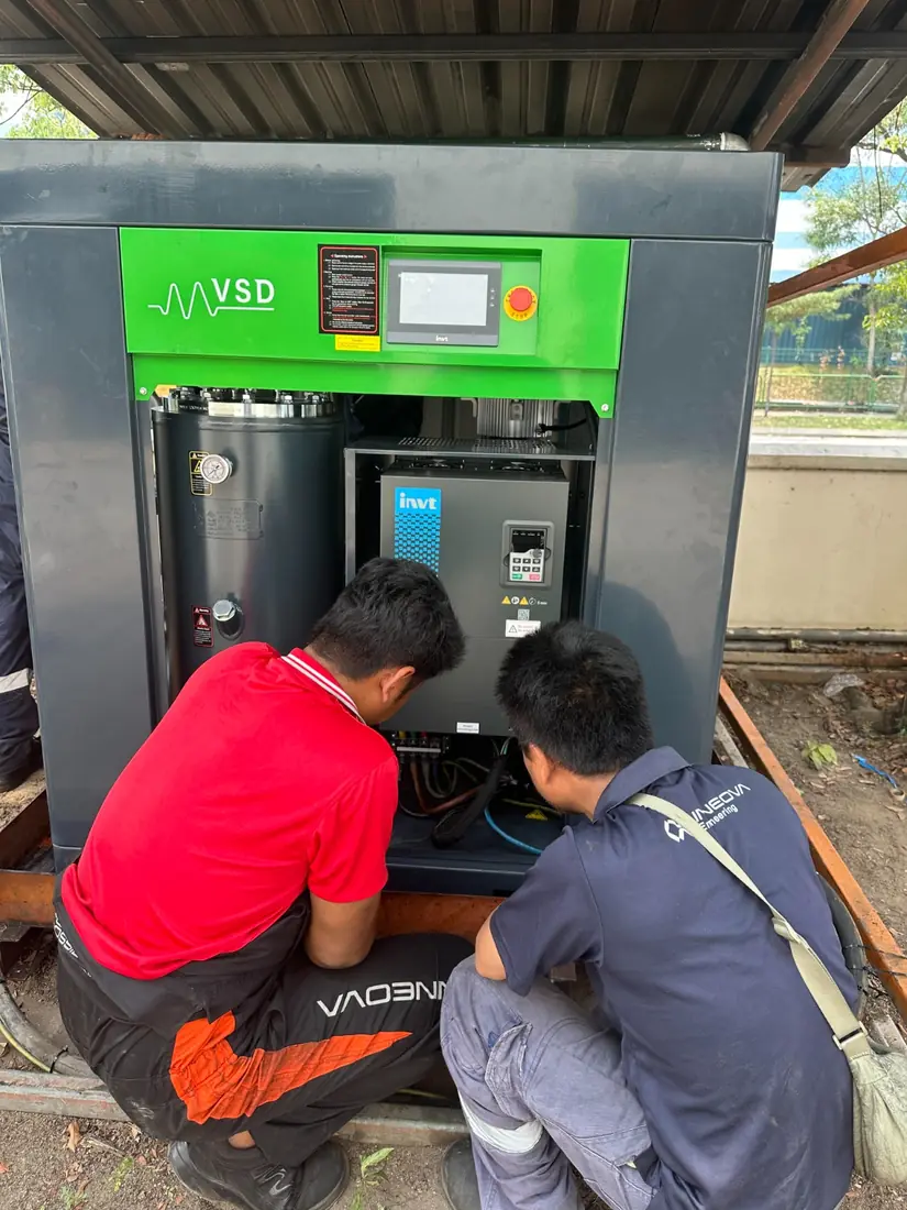INNEOVA engineers working on a compressor