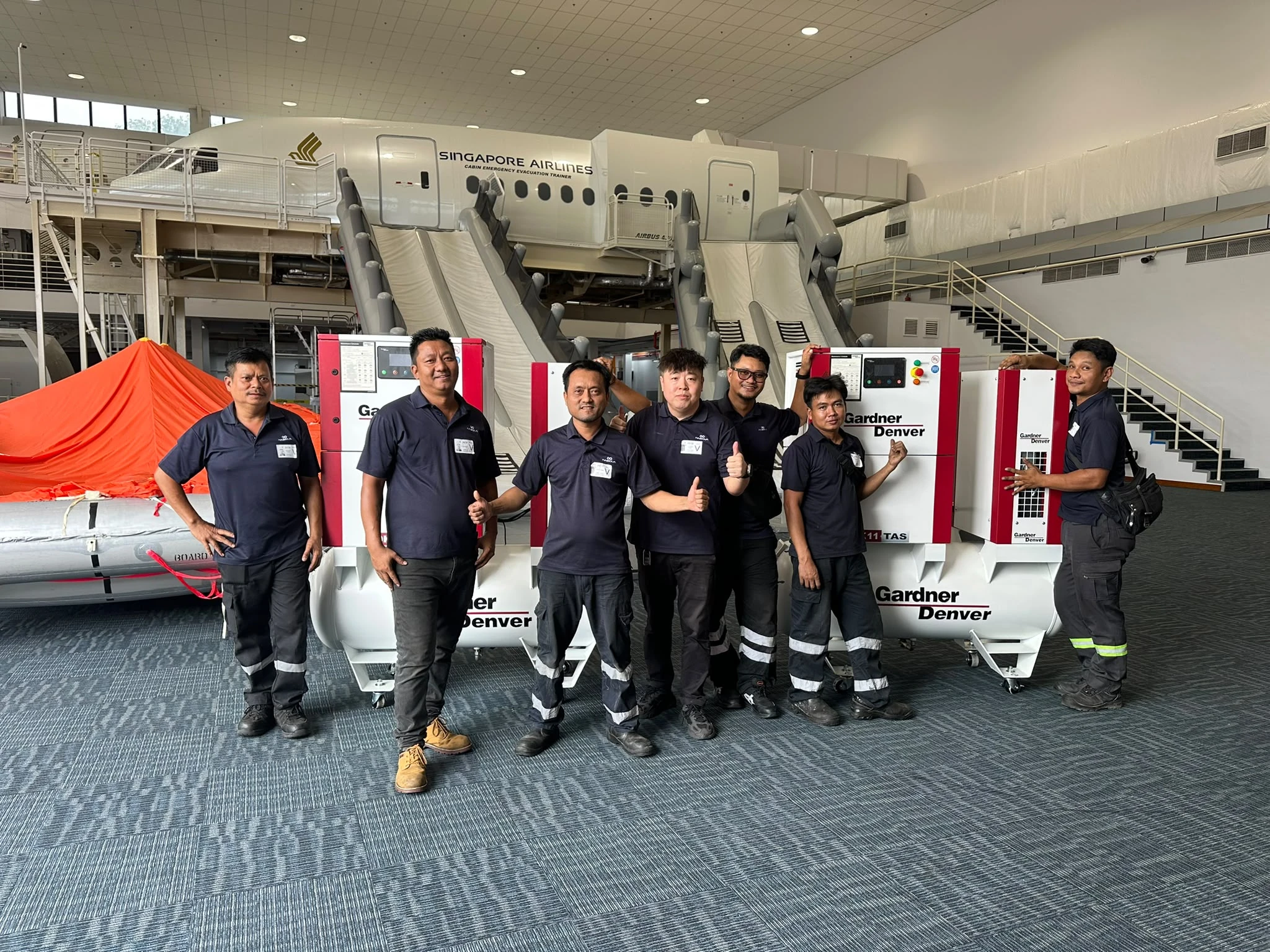 INNEOVA team with Gardner Denver compressed air equipment at an aviation training facility