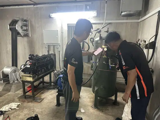 INNEOVA technicians servicing an air compressor