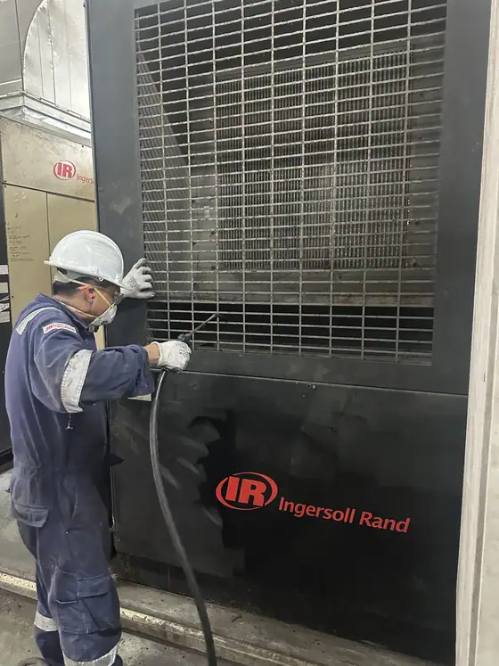 INNEOVA technicians servicing an air compressor