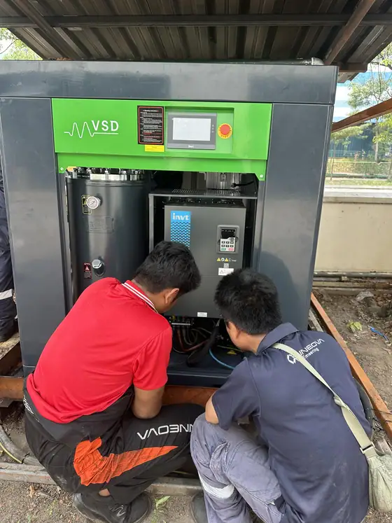 INNEOVA technicians servicing an air compressor
