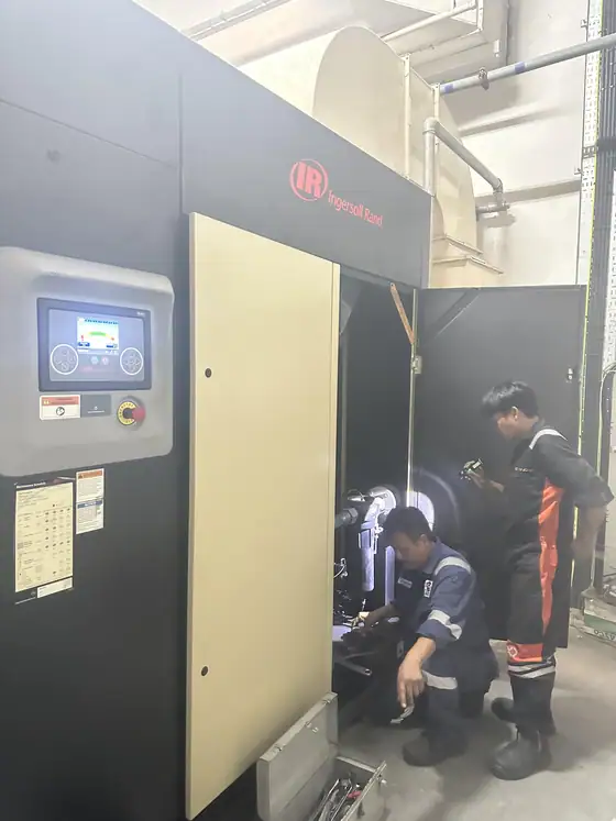 INNEOVA technicians servicing an air compressor