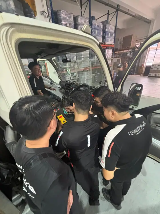 Technical team supporting automotive service